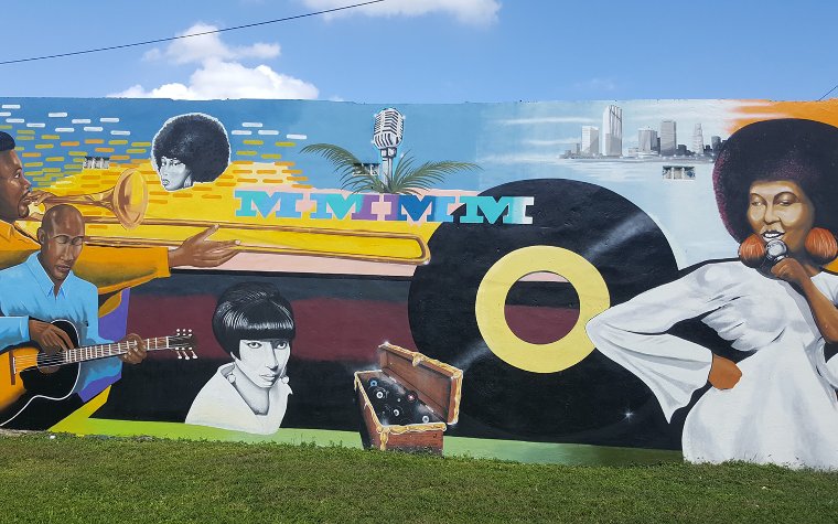 Colorful mural of Black artists, musical instruments and a vinyl record Colorful mural of Black artists, musical instruments and a vinyl record