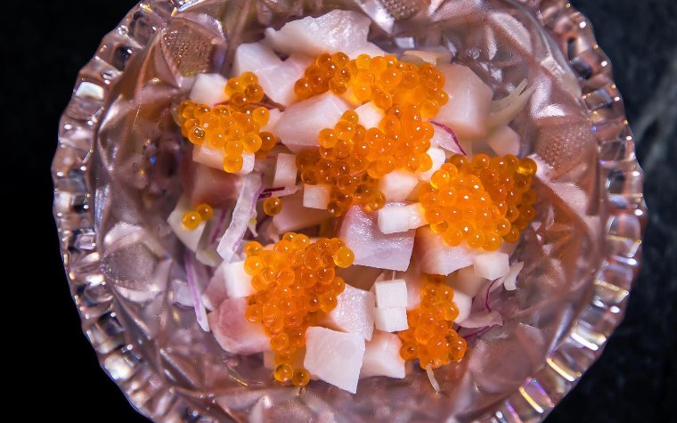 Cote Ceviche topped with bright orange trout roe Cote Ceviche topped with bright orange trout roe