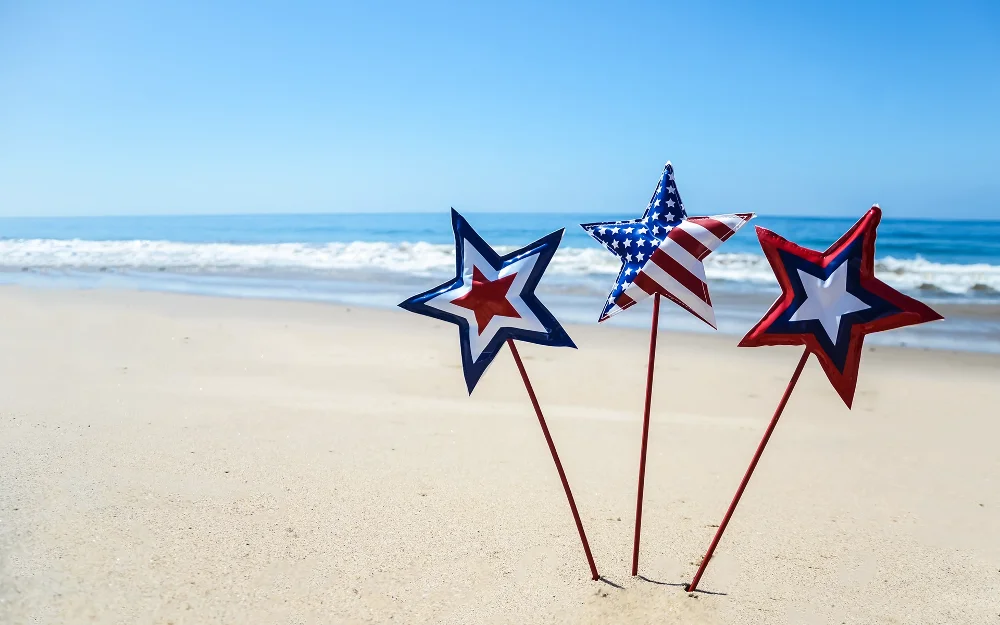 Stars with American flags on the beach