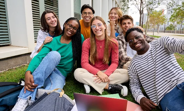 Group of students studying on lawn