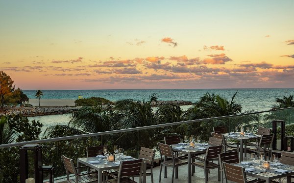 Patio area at Artisan Beach House with a sunset view
