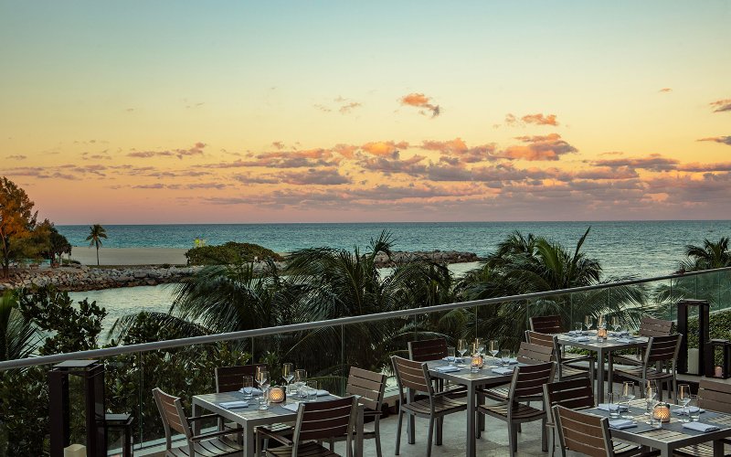 Patio area at Artisan Beach House with a sunset view