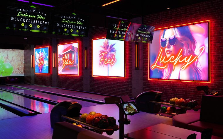 A neon wall and bowling lanes at Lucky Strike A neon wall and bowling lanes at Lucky Strike