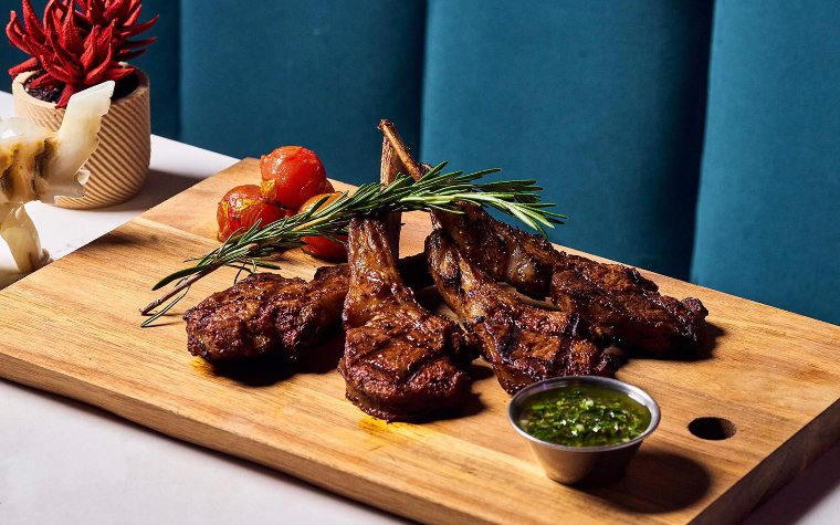 Grilled lamb chops served with mint chimicurri at R House Grilled lamb chops served with mint chimicurri at R House