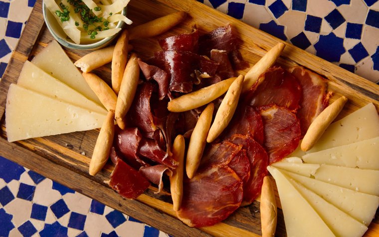 Charcuterie board at Tropezón with assorted cured meats and cheeses