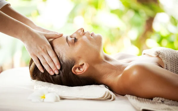 Woman getting a head massage