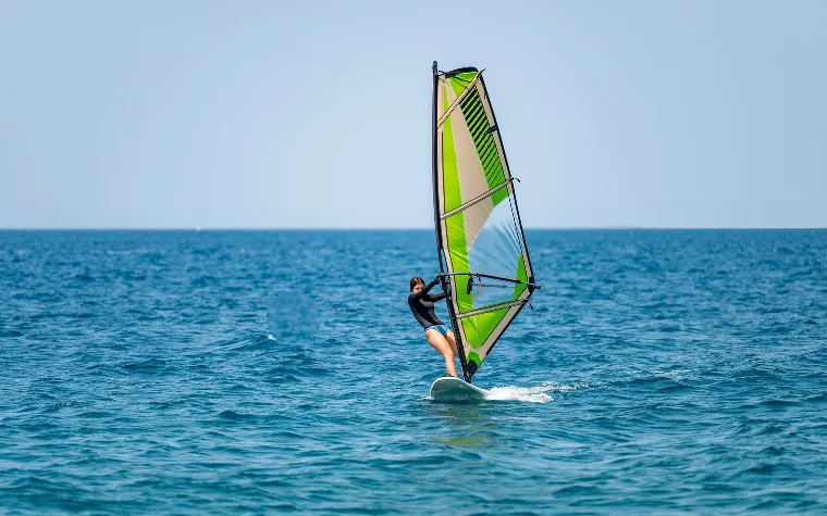 Windsurfer gliding across the ocean