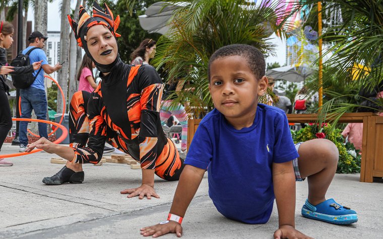 Boy and performer at Children's Alley