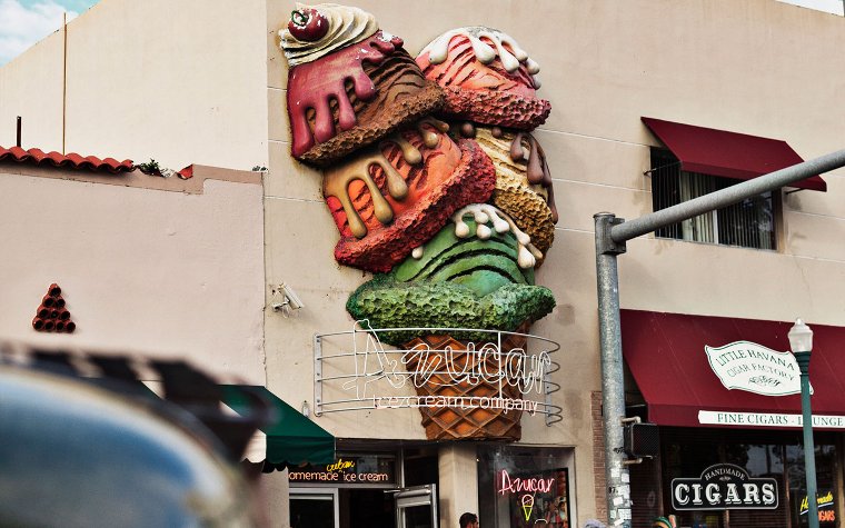Colorful scoops of ice cream in a cone on Azucar Ice Cream Company's exterior Colorful scoops of ice cream in a cone on Azucar Ice Cream Company's exterior