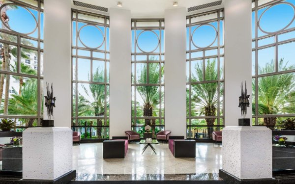 View of Loews rotunda Palm Court seating area and large windows